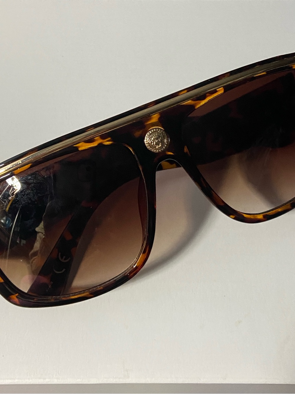 NY Tortoiseshell Shield Sunglasses with 
Gold Lion Head Medallion Accent